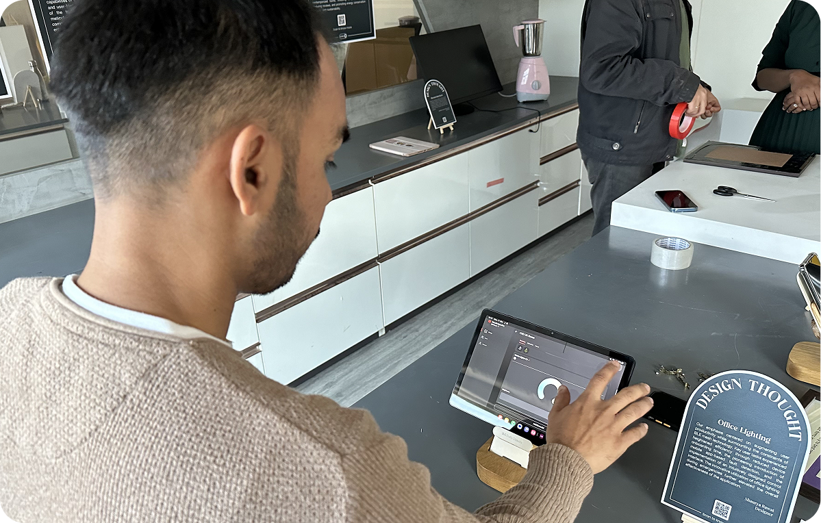 Vineet testing an IoT control interface on a tablet