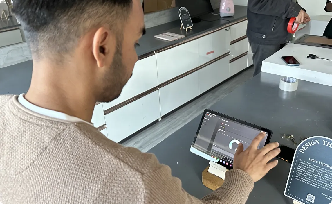Vineet testing an IoT control interface on a tablet